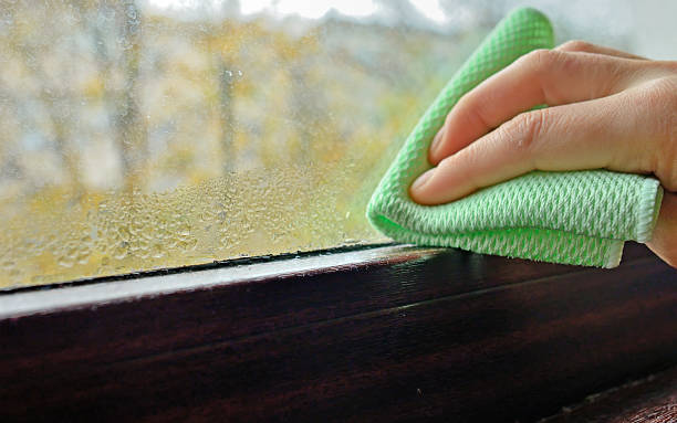 istock Cleaning water  condensation on window 622223612