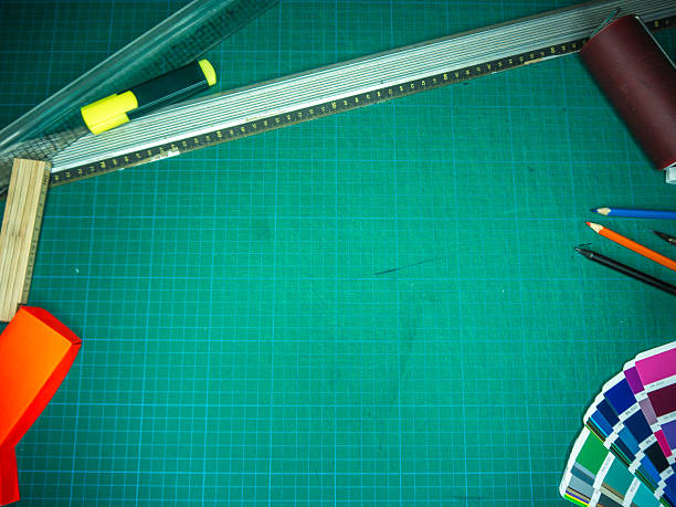 istock Cutting mat with various stationary tools, shot from above 622223668