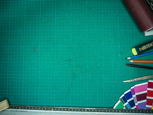 istock Cutting mat with various stationary tools, shot from above 622223864