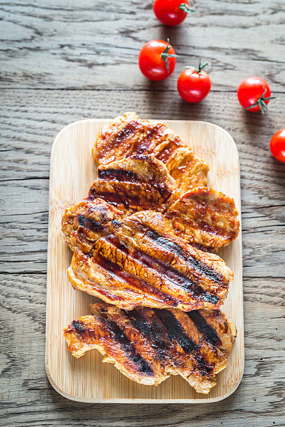 istock Grilled pork steaks on the wooden board 622224210