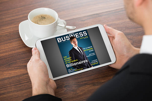 istock Businessman Reading Online Magazine On Digital Tablet 622225162