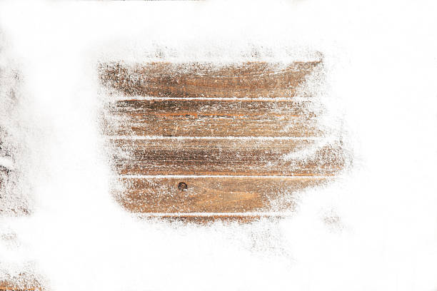 istock snowy frame on wooden background 622278450