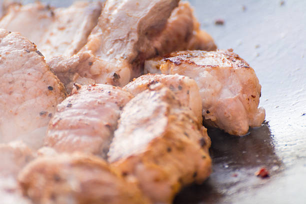 The meat is cooked in a cauldron