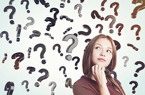 istock Young woman with braided hair and floating question marks 622280452