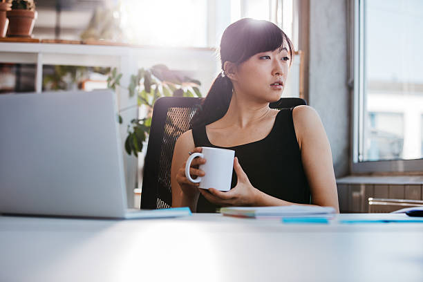 istock Business woman taking coffee break in office 622281300