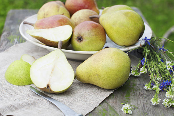 Organic pears on wooden table stock photo