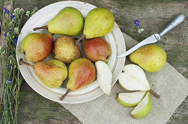 Organic pears on plate stock photo
