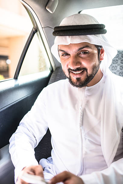 istock sheik on the phone inside a taxi 622283276