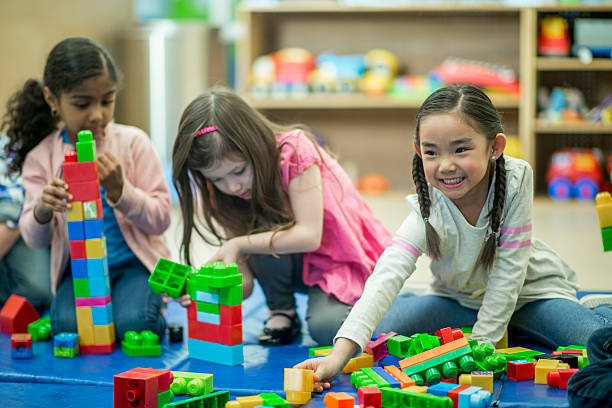 istock Young Girls Playing Together in Class 622287144