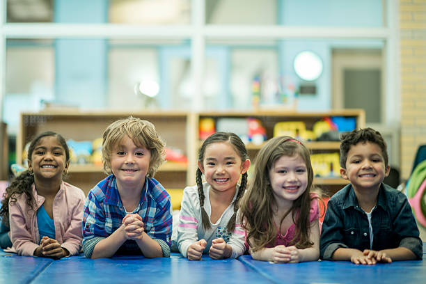 istock Children Lying in a Row Together 622287160