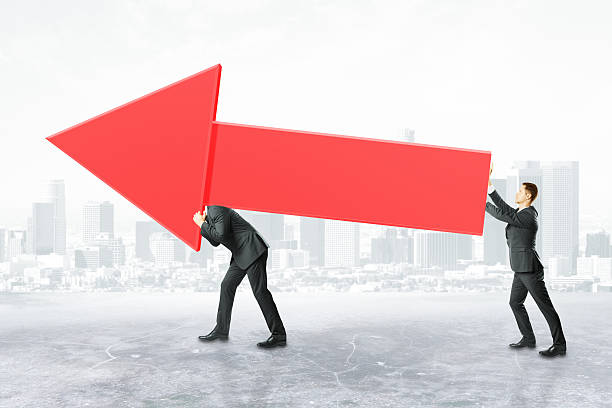 istock Businesspeople carrying red chart arrow 622287314