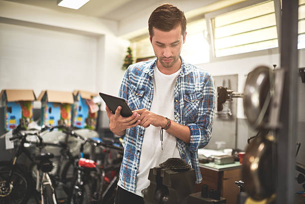 istock Mechanic in bicycle store 622287510