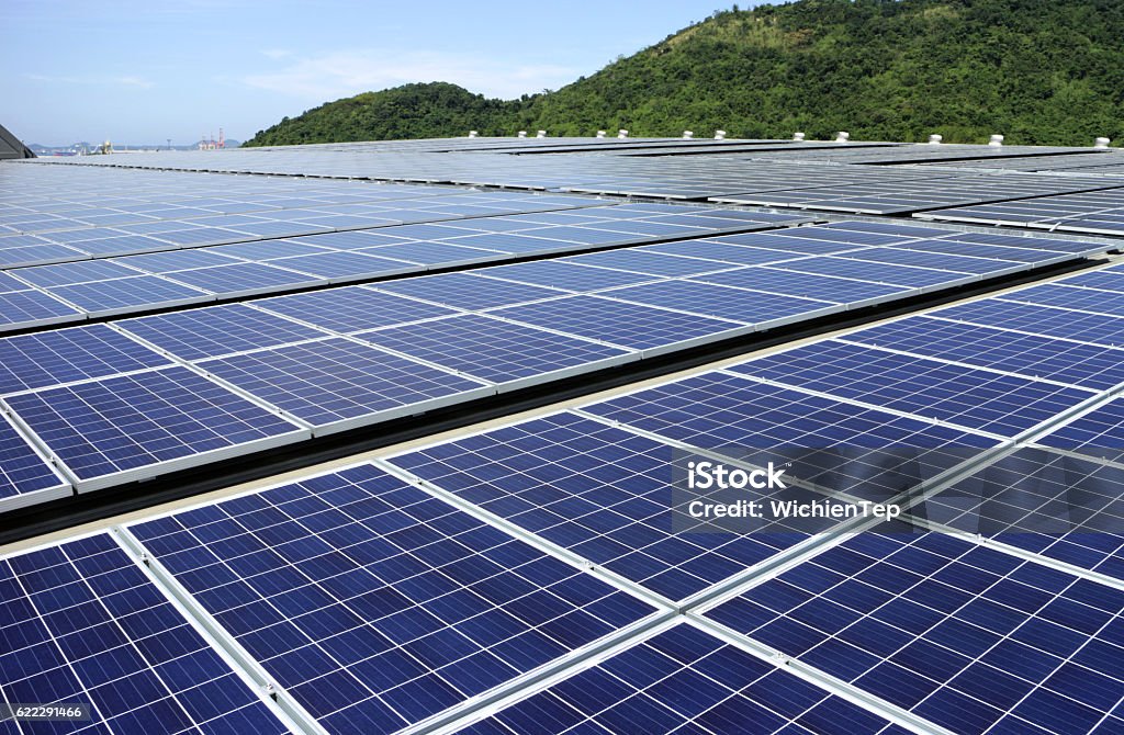 Solar PV Rooftop System Mountain Background Solar Energy Stock Photo