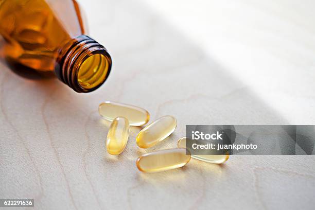 Vitamins With Spilled Content Stock Photo - Download Image Now - Vitamin D, Nutritional Supplement, Vitamin B