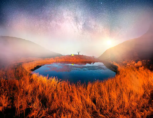 Photo of Cyclist in the mountains at night