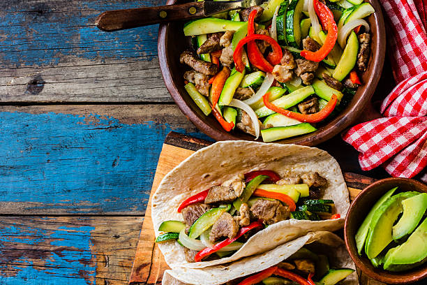 istock Mexican pork tacos with vegetables. Top view 622294116