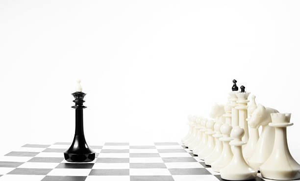 istock Alone black chess king in front of enemy team 622294188