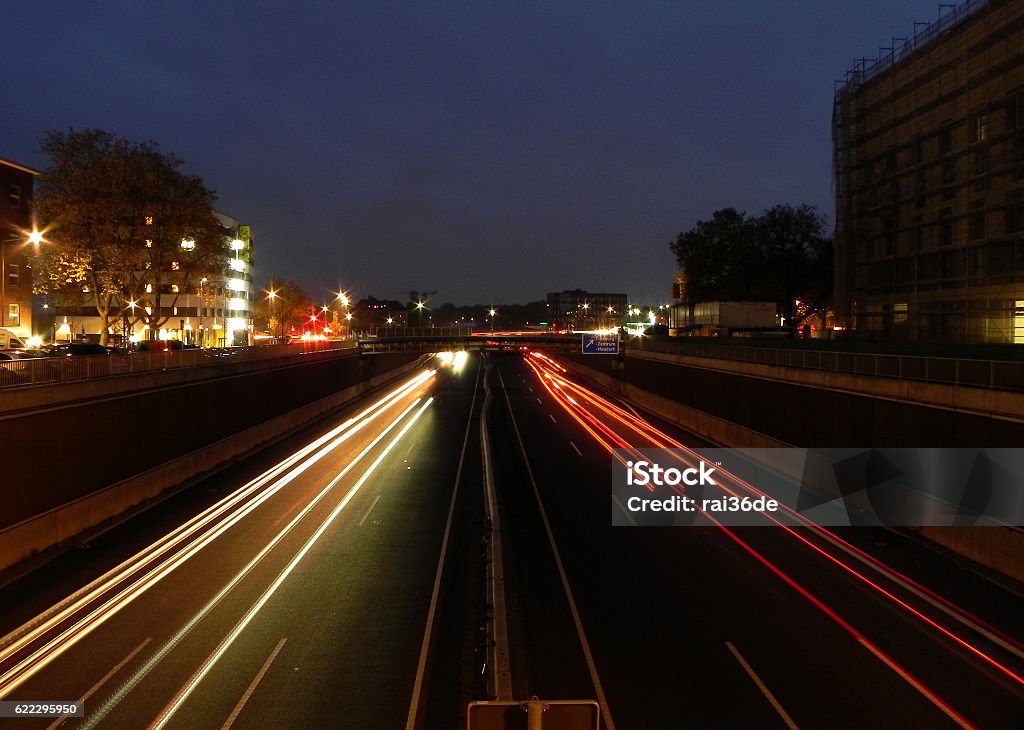 alignment Lights on the highway. Headlights and brake lights of the moving cars. Asphalt Stock Photo
