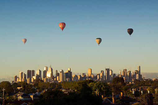 Hot air balloons over Melbourne at sunrise. 