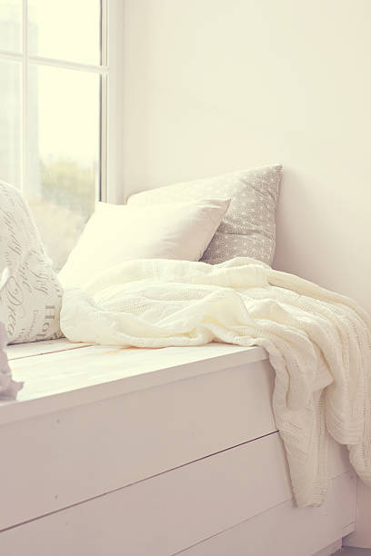 istock pillows and warm knitted plaid 622303248