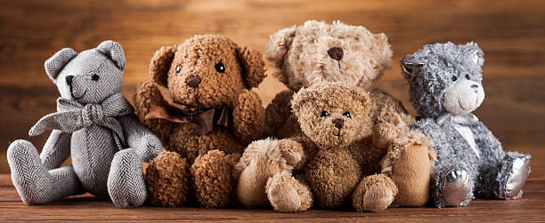 istock Cute teddy bears on wooden background 622305158