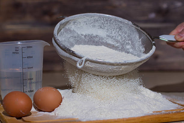 istock Sift the flour through a sieve. 622308104