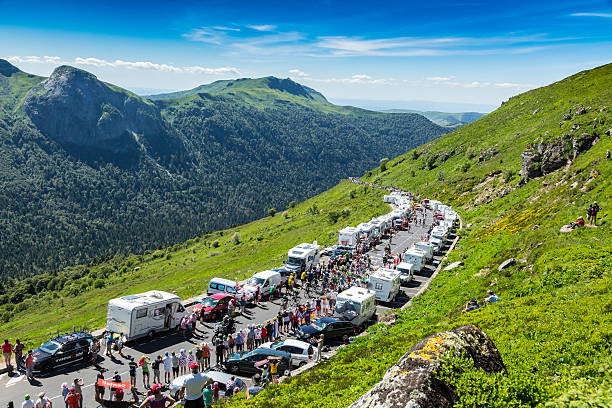 The Peloton in Mountains - Tour de France 2016 Pas De Peyrol, France - July 6, 2016: The peloton riding on the road to Pas de Pyerol (Puy Mary) in Cantal in the Central Massif during the stage 5 of Tour de France on July 6, 2016. tour de france stock pictures, royalty-free photos & images