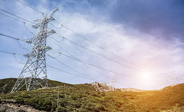 istock high voltage electrical power line in the field on mountain 622309632