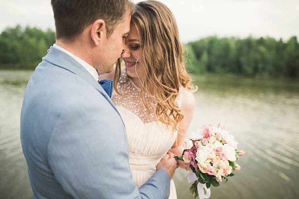 istock Happy wedding couple hugging and smiling each other on the 622310020