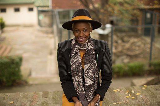 African american woman with hat posing outdoor