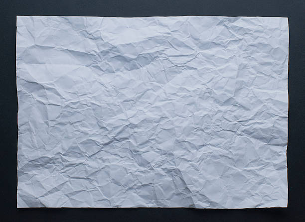 istock White creased paper texture on black background 622312688