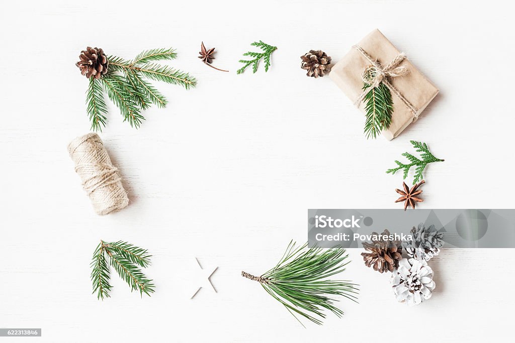 Christmas gift, pine cones, fir branches. Top view, flat lay Christmas frame. Christmas gift, pine cones, fir branches. Top view, flat lay Flat Lay Stock Photo