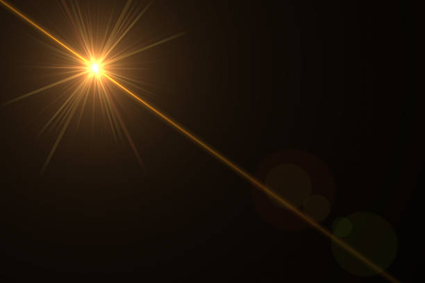 istock abstract lens flare yellow light over black background 622313920