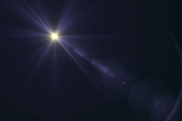 istock abstract lens flare yellow light over black background 622313992