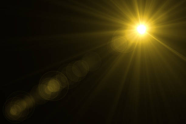istock abstract lens flare yellow light over black background 622314052