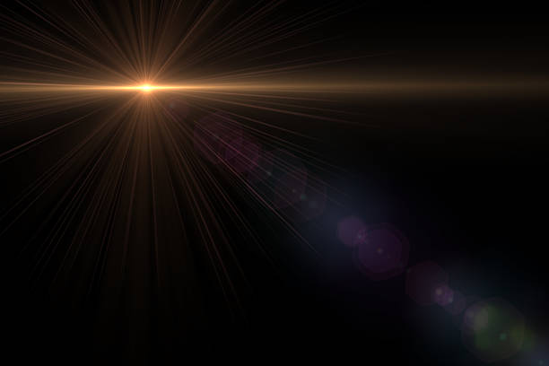 istock abstract lens flare yellow light over black background 622314066