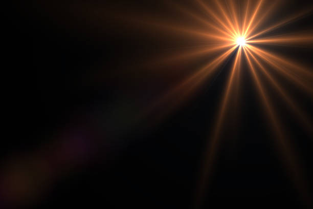 istock abstract lens flare yellow light over black background 622314096