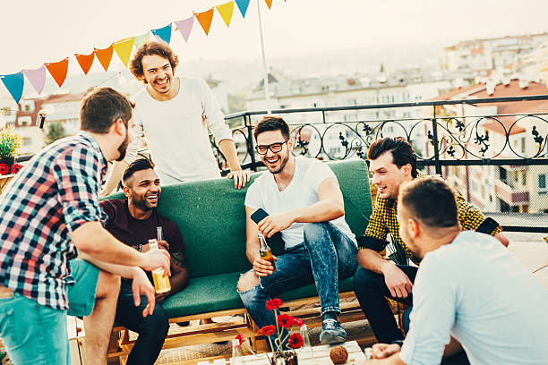 istock Men having a party on the roof 622314422