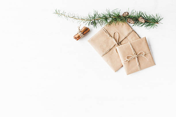 Larch branches, cinnamon sticks, christmas gift. Flat lay, top view