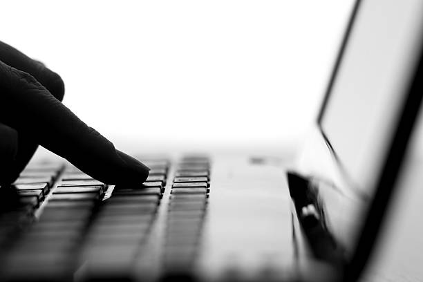 istock silhouette of the finger press a key on the keyboard 622314876