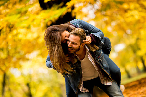 istock Young couple in the autumn park 622315596