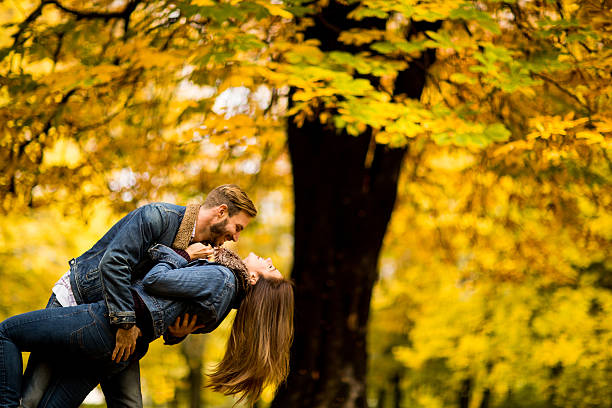 istock Young couple in the autumn park 622315696