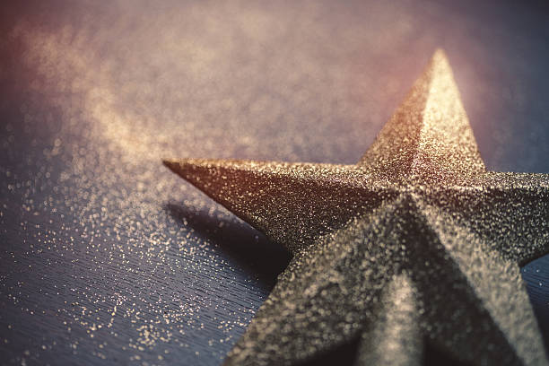 istock Christmas star on dark wooden background 622317408