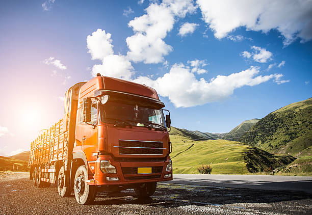 istock red truck on blurry asphalt road 622317578