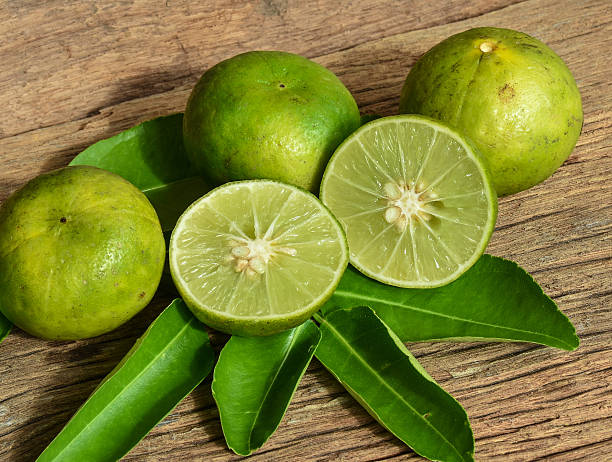 istock Fresh lemon fruits on wood background. 622317914