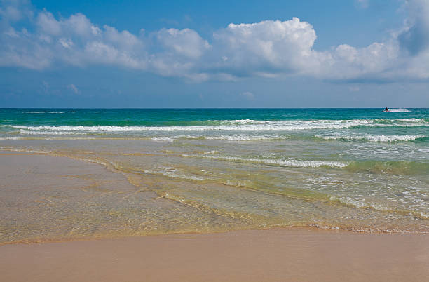 istock Coastline at empty sea and beach background 622319304