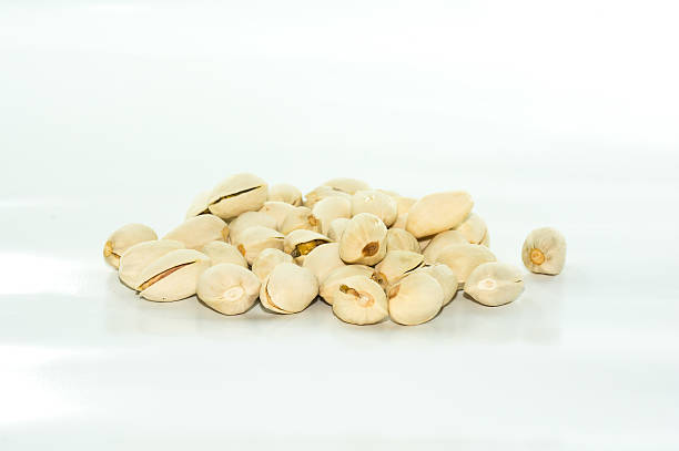 istock Close up of Pistachio nuts on white background 622322046