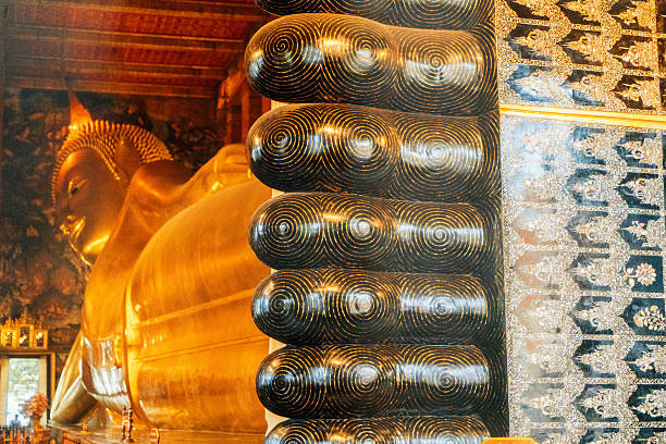 The golden Buddha at the temple of Wat Pho in the city of Bangkok in Thailand in Southeastasia.