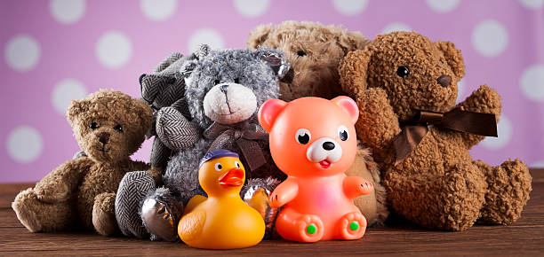 istock Cute teddy bears on wooden background 622323020