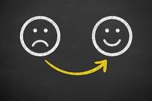 istock Drawing Unhappy and Happy Smileys on Chalkboard 622323384
